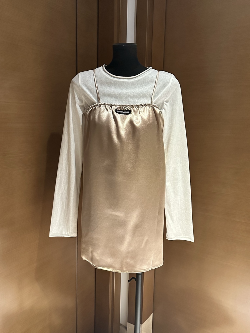 Miu Miu micro-permeable base top paired with a halter dress set